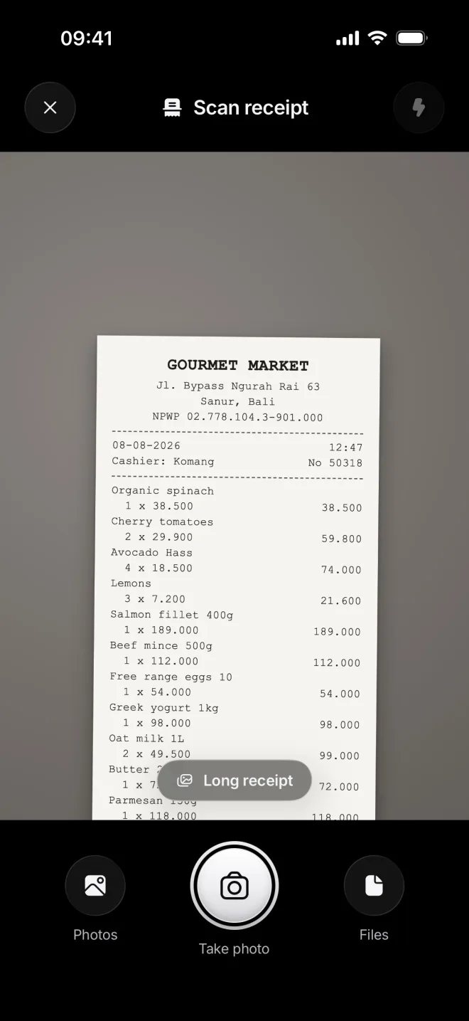 The scanner over the top of a long Gourmet Market receipt, with Long receipt above the shutter